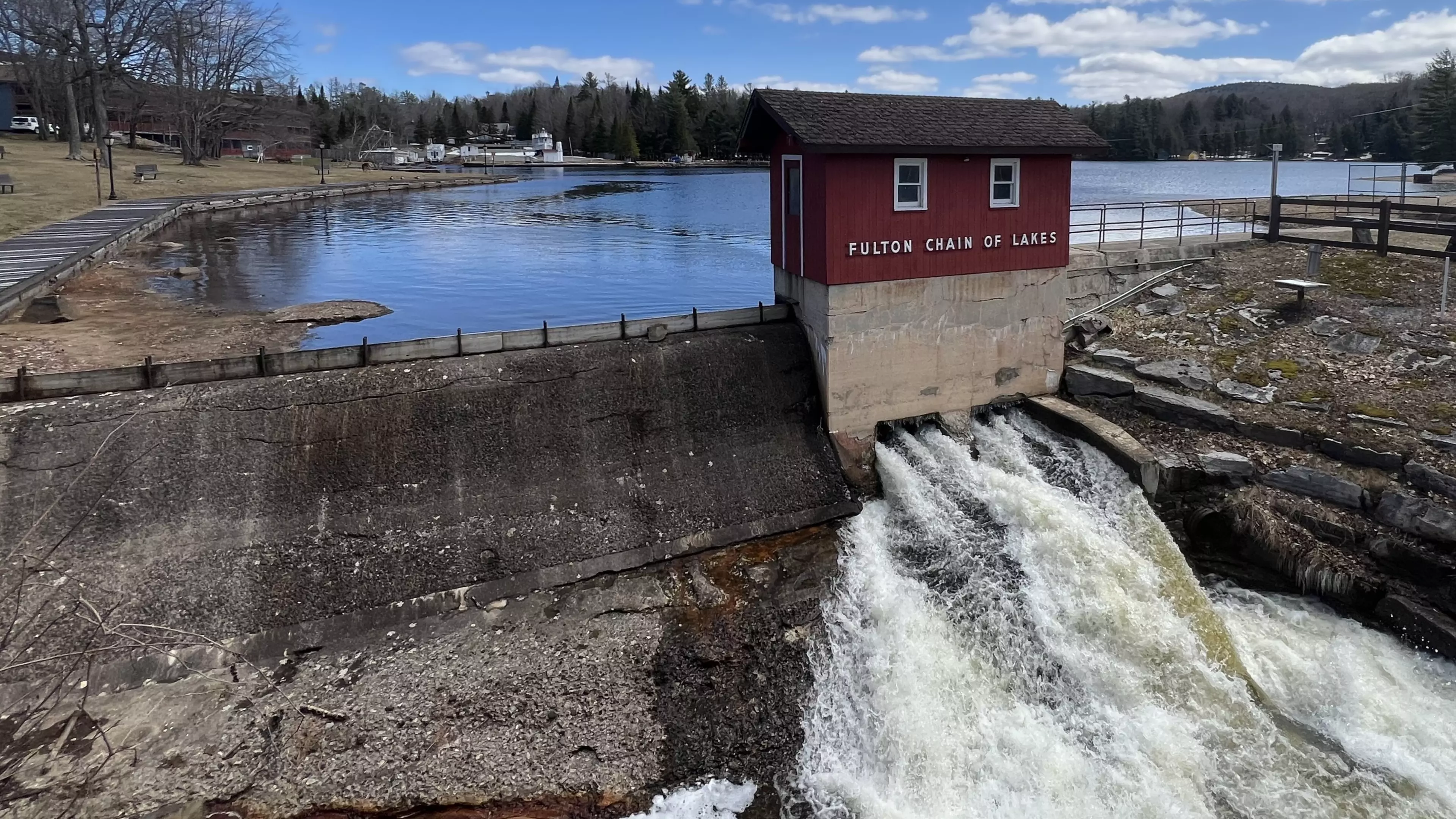 A view of the red dam house at the Old Forge pond. 